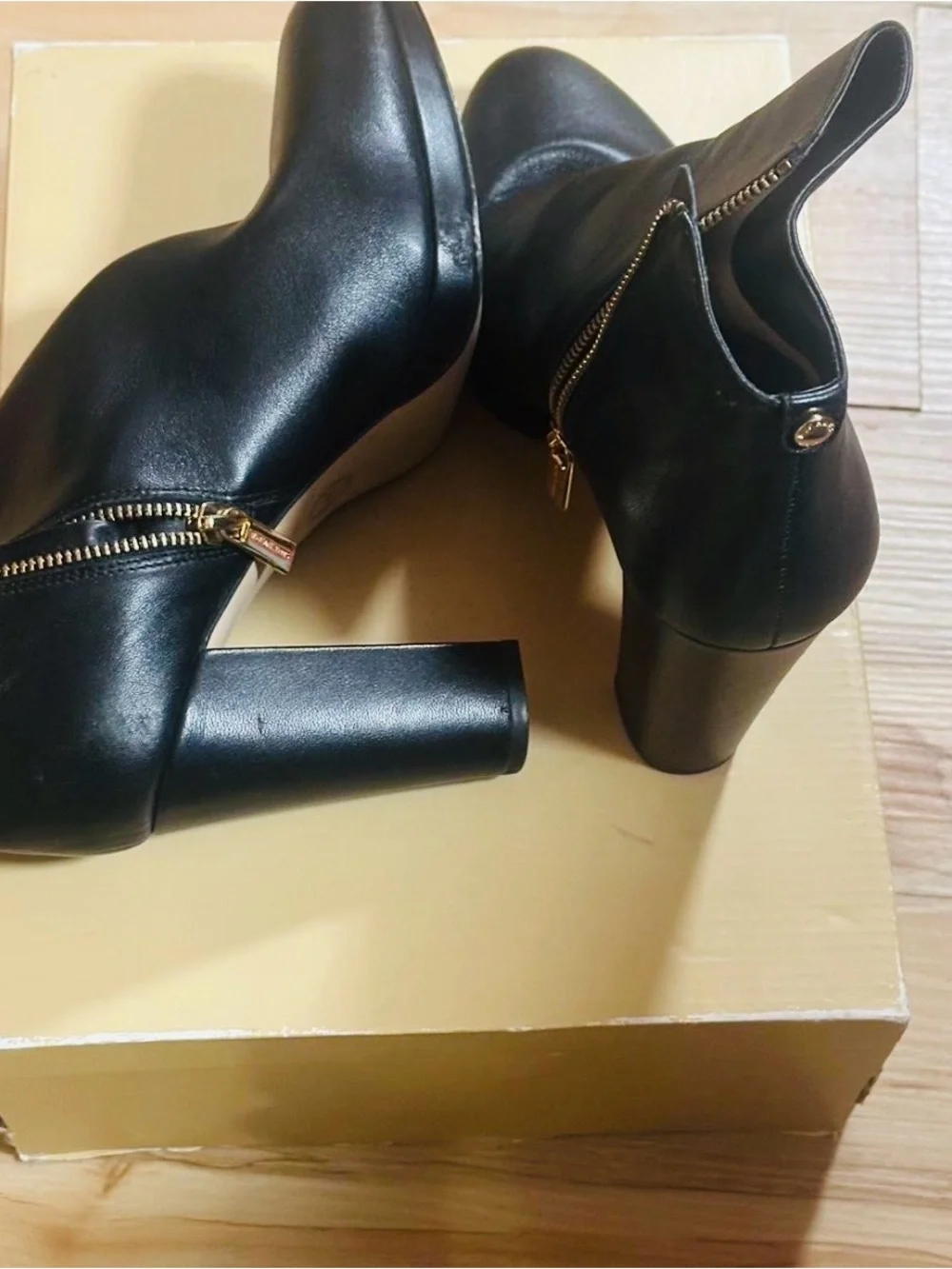 Michael Kors Sammy Platform Black Leather Ankle Booties with Gold Zipper.